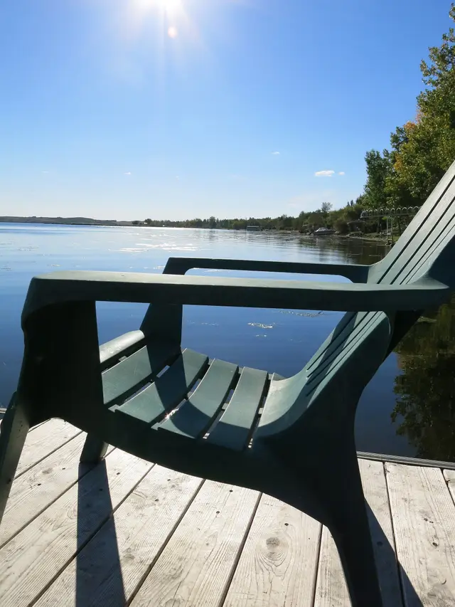 Adirondack chair on a dock at Jackfish Lake