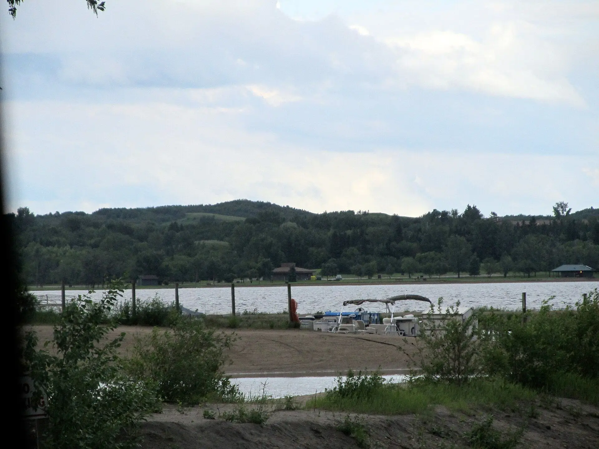 Jackfish Lake shoreline with pontoon boats